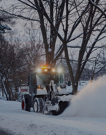 Machine clearing snow off a street